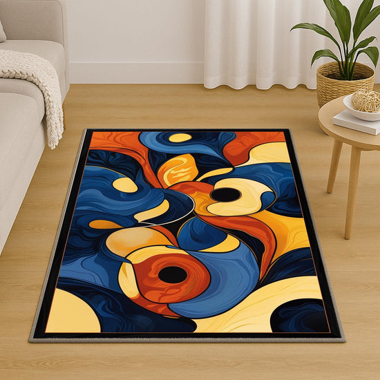 Modern abstract chenille rug with fluid shapes in navy, orange, golden yellow, and beige, washable with non-slip recycled cotton backing.