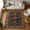 Aztec-inspired chenille rug with oriental influence, navy background, red and gold tribal geometric motifs, washable non-slip backing, perfect for boho and rustic decor.