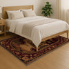 French Victorian tapestry rug with an antique floral border, depicting a charming old-town street scene in warm burgundy, gold, and cream tones.