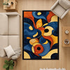 Modern abstract chenille rug with fluid shapes in navy, orange, golden yellow, and beige, washable with non-slip recycled cotton backing.