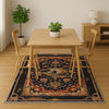 French tapestry style chenille rug featuring a vintage garden scene with trees and flowers, surrounded by a rich oriental border in navy, red, and gold tones. Washable, non-slip, and perfect for Victorian or dark academia interiors.