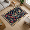 Vintage French floral tapestry rug with black background, ornate red and cream flowers, and antique cream border, washable chenille carpet for elegant home decor.