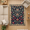 Vintage French floral tapestry rug with black background, ornate red and cream flowers, and antique cream border, washable chenille carpet for elegant home decor.